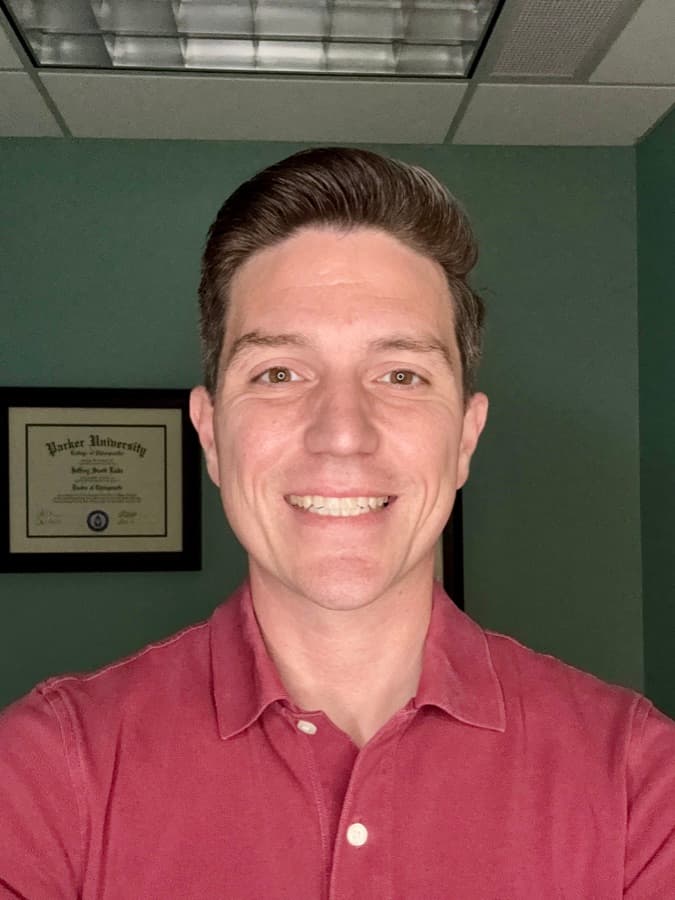 Dr. Jeff Luke, D.C., smiling in his Georgetown office